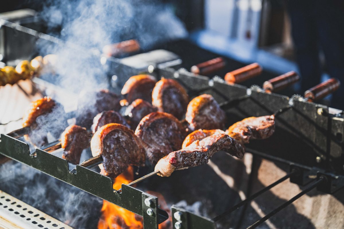 Picanha skewers grilling over open flame