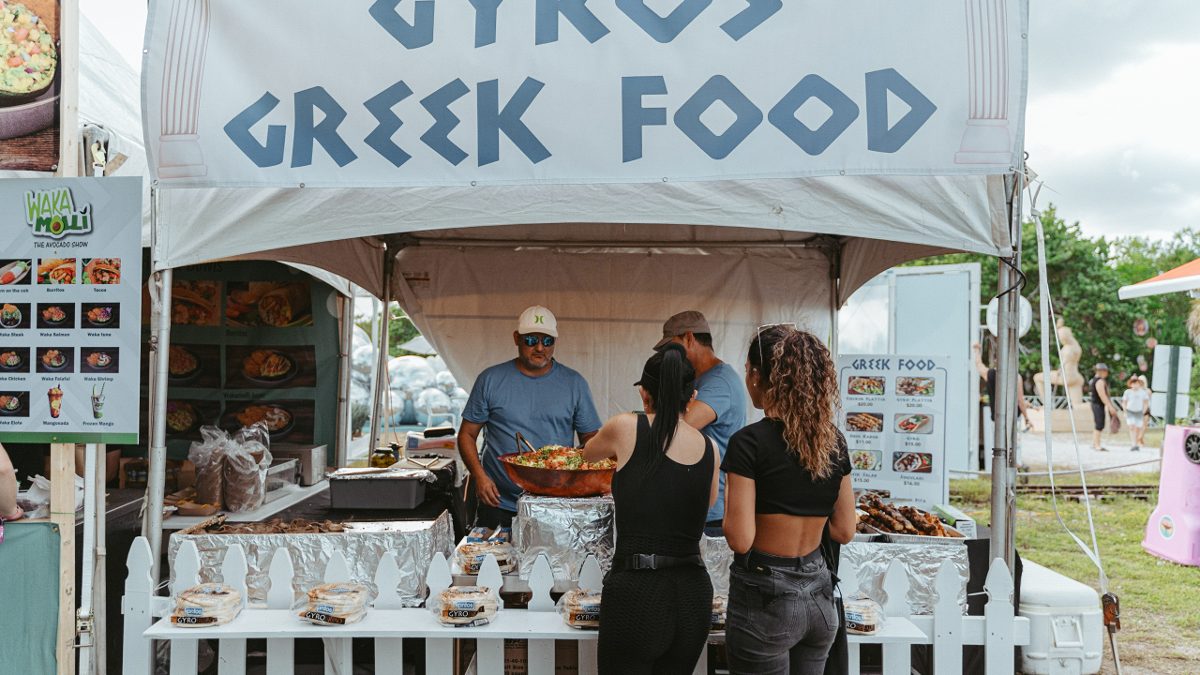 Guests order fresh gyros at a Greek food stand