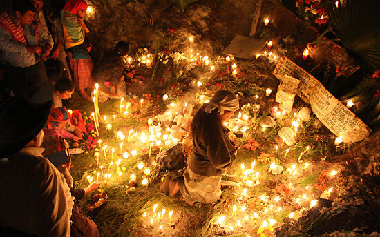 Candles and offerings on the ground for Day of the Dead ceremony